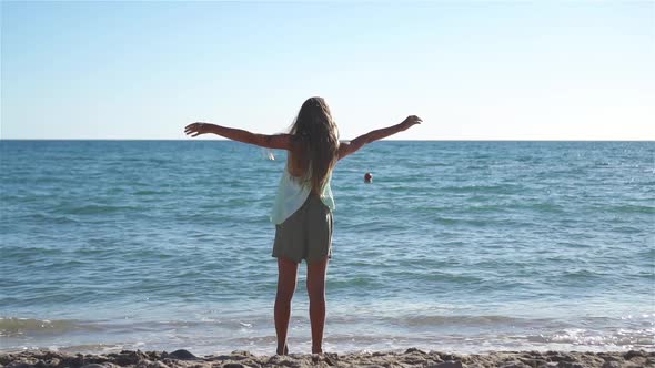 Adorable Little Girl at Beach During Summer Vacation