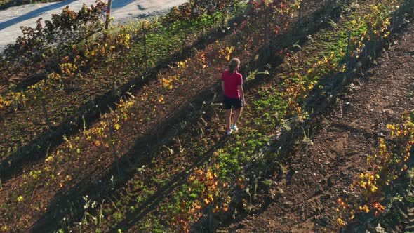 Man Strolls Along Unspoiled Agricultural Field