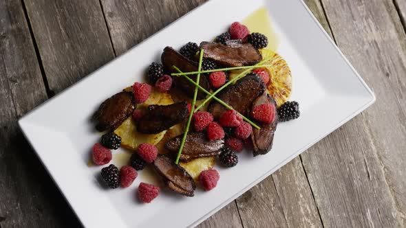 Rotating - smoked duck bacon with grilled pineapple, raspberries, blackberries and honey