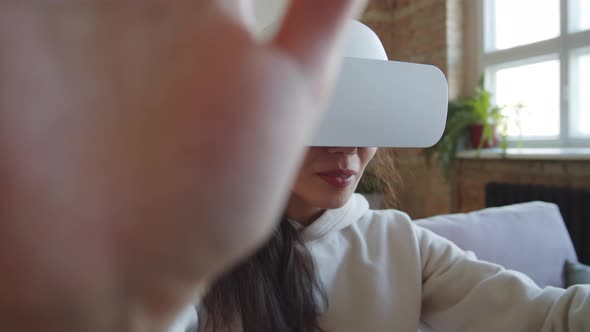 Cheerful Woman Enjoying Augmented Reality with VR Glasses