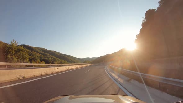 Summer Road Trip on Europe Firstperson View of a Moving Car on a Highway Hills and Mountains Natural