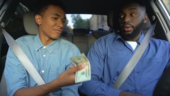 Son Asking Pocket Money From Dissatisfied Father Sitting in Car, Generation Gap