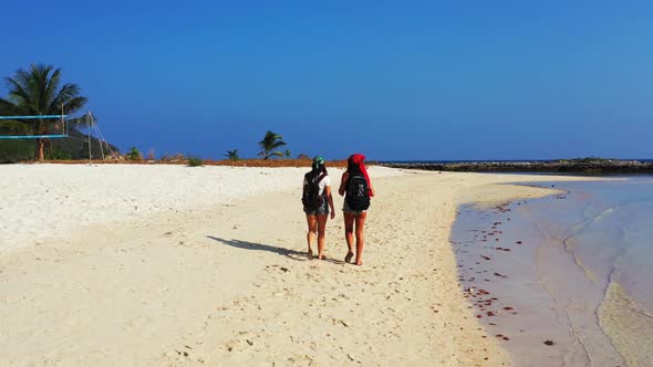 Beautiful women sunbathing on paradise coastline beach journey by transparent water and bright sandy