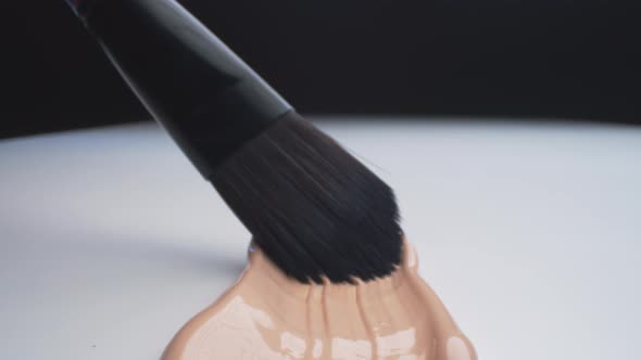 Beige Foundation Spreading Using Brush