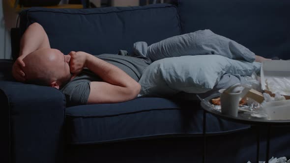 Depressed Upset Man Caused By Break Up Lying on Sofa