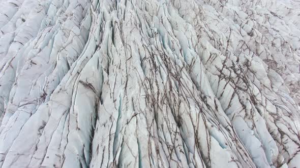 Glacier, Ash, Cracks and Crevasses. Iceland. Aerial View