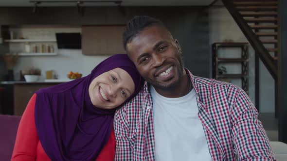 Portrait of Happy Loving Diverse Multiracial Muslim Couple Smiling Indoors