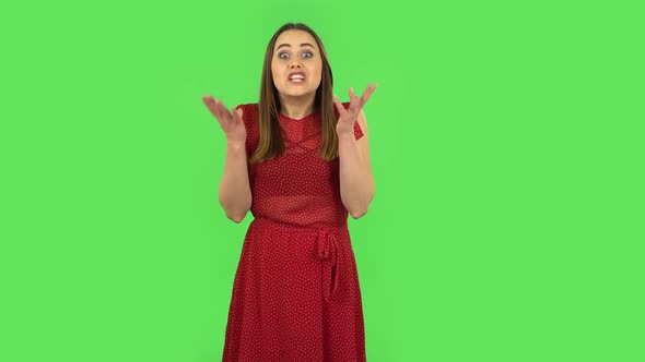 Tender Girl in Red Dress Is Talking About Something Then Making a Hush Gesture, Secret. Green Screen