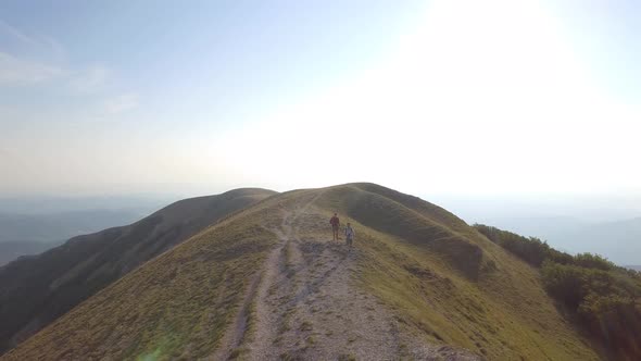 Drone view of two friends hiking in the Apennines, Umbria, Italy