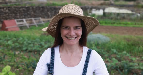 Mature caucasian woman working at ecological farm - Fresh food and harvest concept