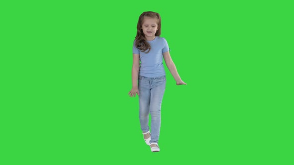 Beautiful Girl Laughs and Dances While Walking on a Green Screen, Chroma Key