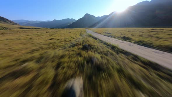 Speed Aerial View Dirt Road Countryside Scenery Autumn Spring Natural Field at Mountain Sunny Valley