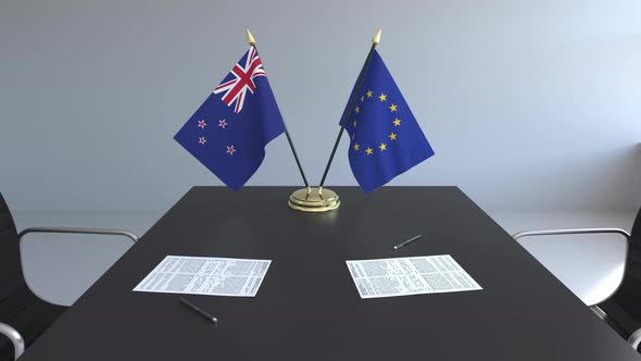 Flags of New Zealand and the European Union and Papers