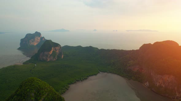 Aerial view over the coast, mountains and beaches during beautiful sunsets