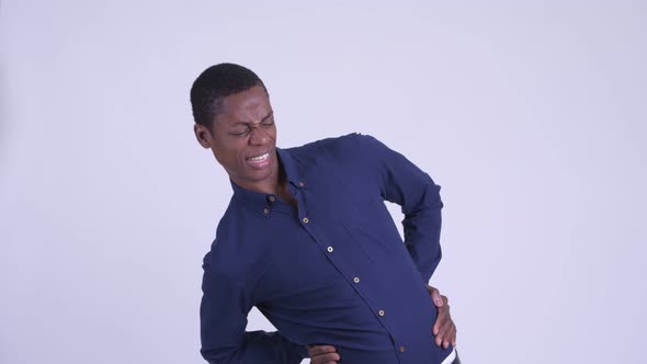 Young Stressed African Businessman Having Back Pain