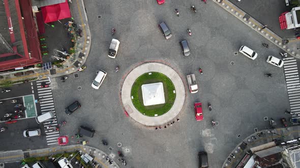 Top aerial view of Tugu Yogyakarta Landmark with busy traffic.