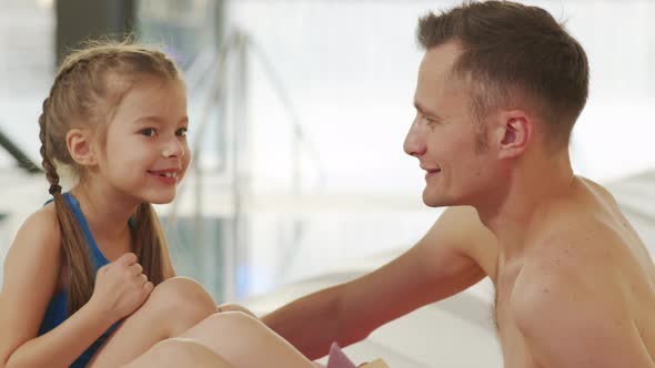 Father And Daughter In Pool