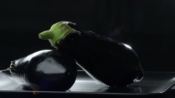 Natural Eggplants on Black Background