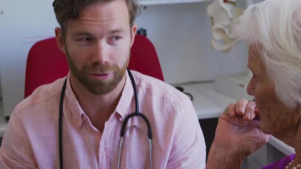 Doctor examining a senior woman in a retirement home