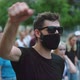 Portrait of Covid Protester in Glasses Facemask with Waving Arm Fist on Rally - VideoHive Item for Sale