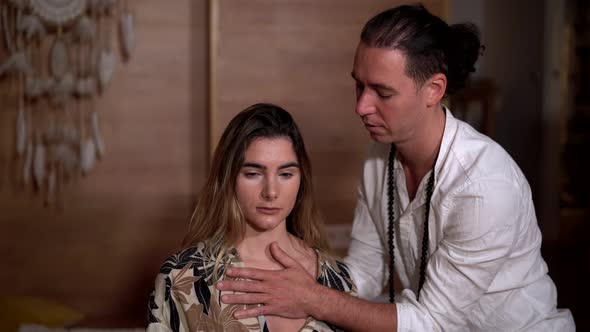 Zen master with woman meditating on plaid