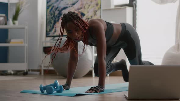 Fit Black Woman in Sportswear Doing Workout Burning Fat Calories