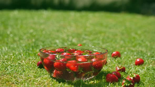 Strawberries slowly moving in water