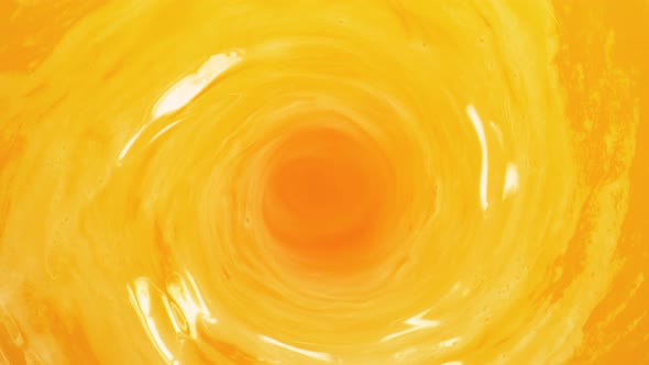 Super Slow Motion Shot of Fresh Orange Juice Whirl at 1000 Fps