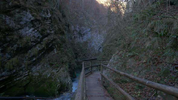 A wooden path by a river in a gorge