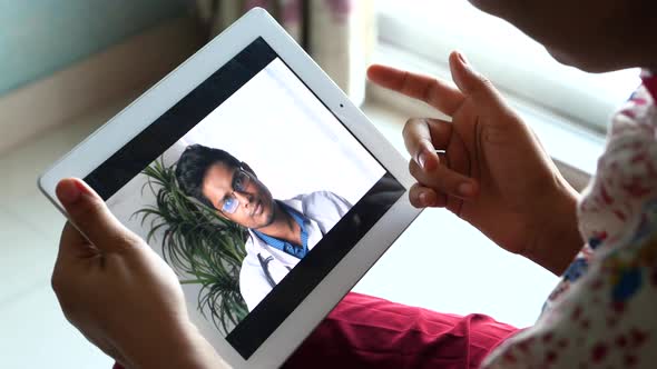 Online Consultation with Doctor on Digital Tablet 