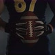 American Football Sportsman Player Holding a Ball on Black Background Close Up - VideoHive Item for Sale