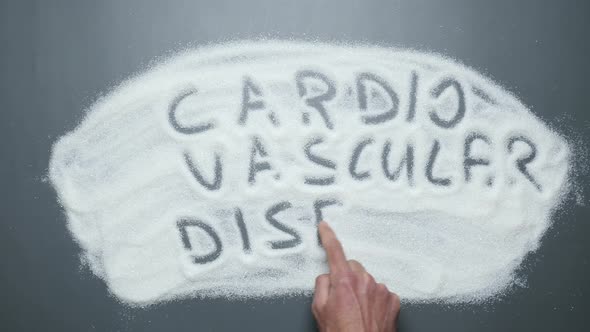 Text Cardiovascular disease written on sugar background. Sugar kills.