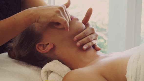 Woman Gets Facial and Head Massage in Luxury Spa