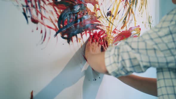 A Picture is Getting Painted By Woman s Bare Hands