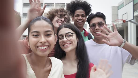 Group of Multiracial Teenager Friends Talking Selfie with Phone Looking to Camera