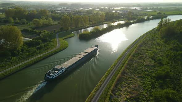 Aerial view in the sunset around à houseboat on a river near Clairmarais, France. There is a village