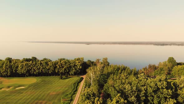 View From Drone Slowly Landing From High Altitude To the Park Alley