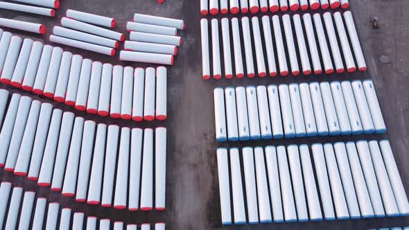 Components Of Wind Turbine Towers Laying On The Ground Of A Windmill Factory In Monroe, Michigan - a