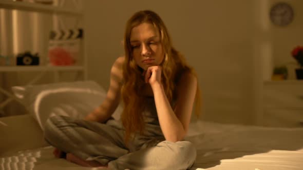 Upset Teenager Thinking Problem Sitting Bed