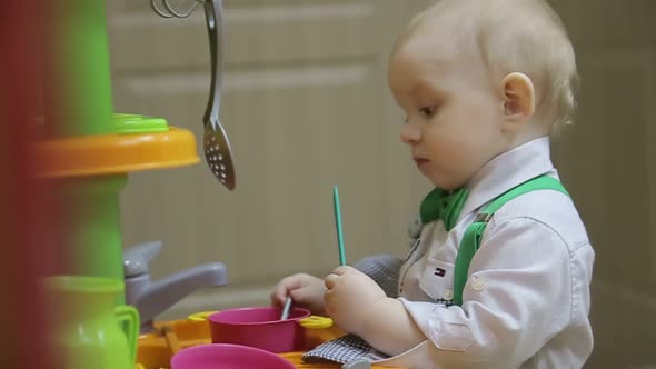 Happy Mother with Her Son Having Fun in the Kitchen