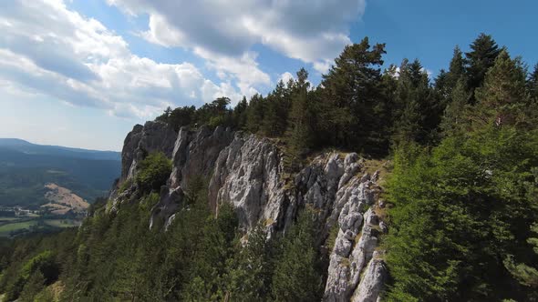 Aerial Cinematic Shot High Speed Sport Fpv Drone Flying Over Natural Mountain Cliff Surrounded