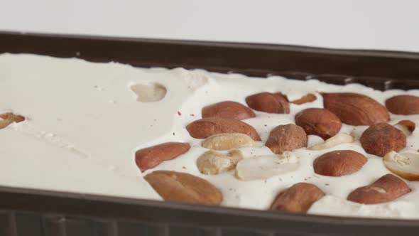 Tilting on halva with pistachio and peanuts 4K footage