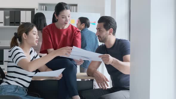 Group of asian young creative happy people casual dress entrepreneur on a Team discussing