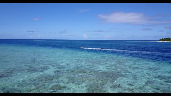 Aerial above texture of tranquil resort beach trip by blue sea and white sand background of a dayout