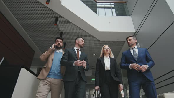 Business Partners with Lawyers Walking through Office