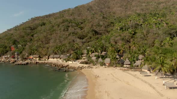 Oceanfront Palapa Huts Of Yelapa Beach Town Near Puerto Vallarta In Jalisco, Mexico. Aerial Drone Sh