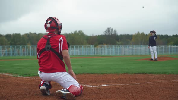 College Baseball, the Pitcher Throws the Ball Towards the Catcher, Catcher Successfully Catch 