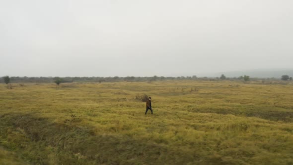 Documentarist taking pictures in a misty moorland in autumn,Czechia.