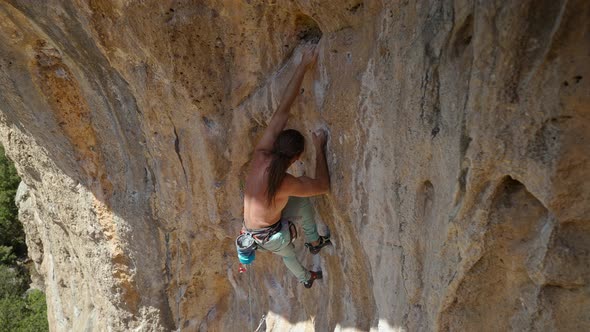 Powerful Rock Climber Climbing on a Big Rock Wall in Turkey