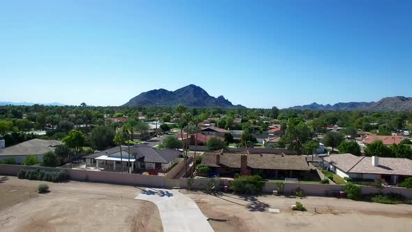 Drone flight tilt up toward Camelback Mountain